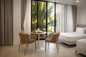 Bright deluxe room at a hotel near SkyRanch Tagaytay with a private balcony