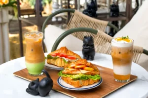 Croissant sandwiches and iced drinks displayed at a stylish cafe in Cavite