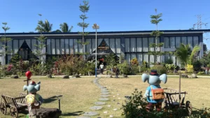 Garden entrance and modern building of a welcoming cafe in Cavite