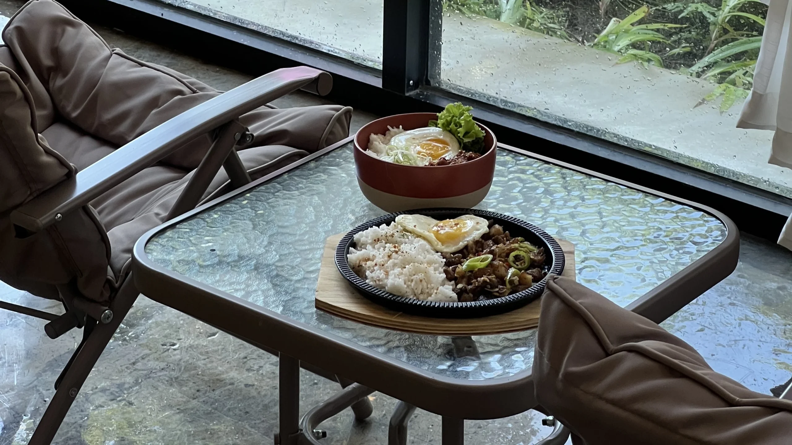 Wondellea Cafe Menu rice meals with egg served beside a rainy cafe window