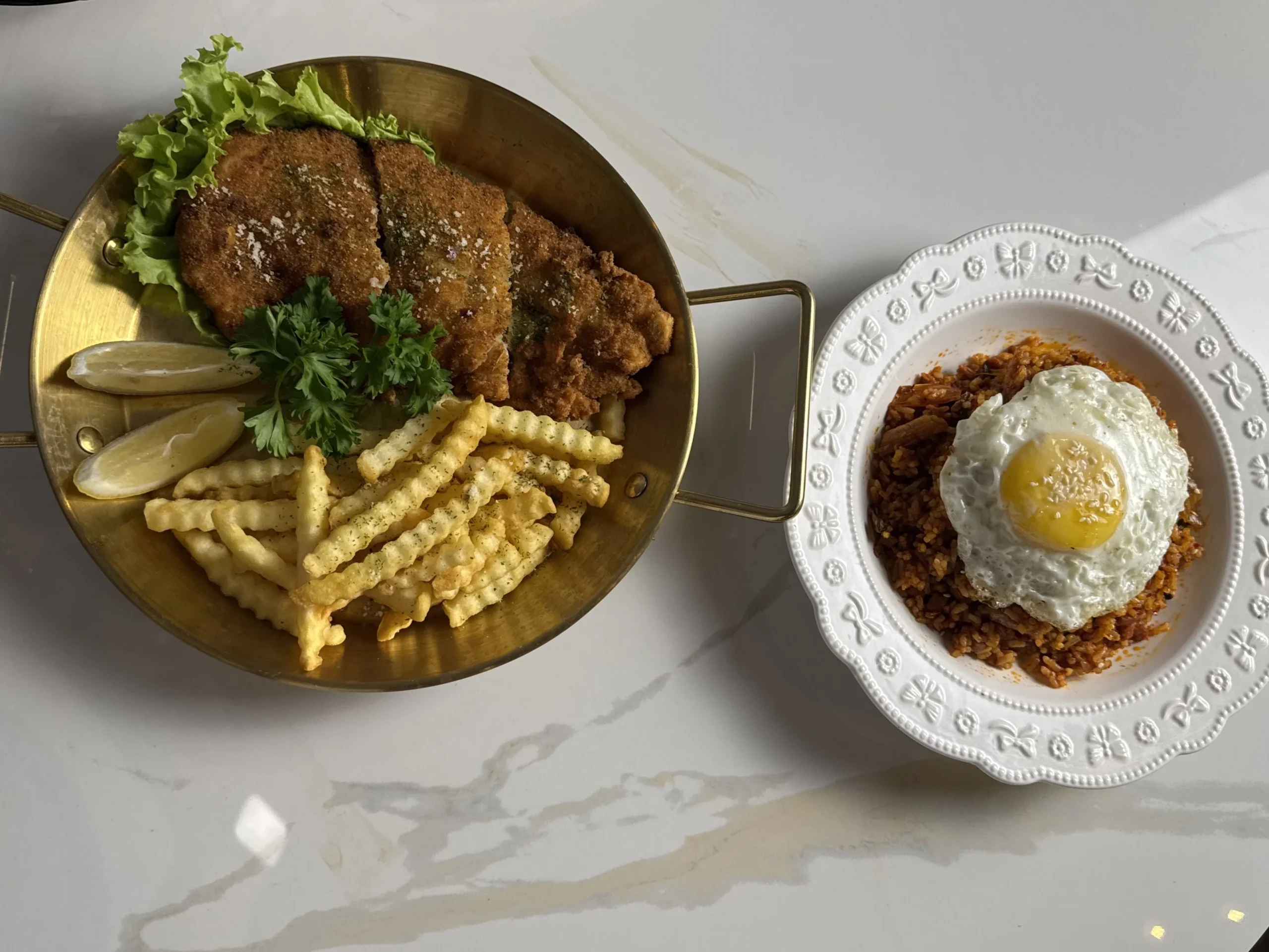 Fried chicken, fries, and rice served at an outdoor cafe in Cavite