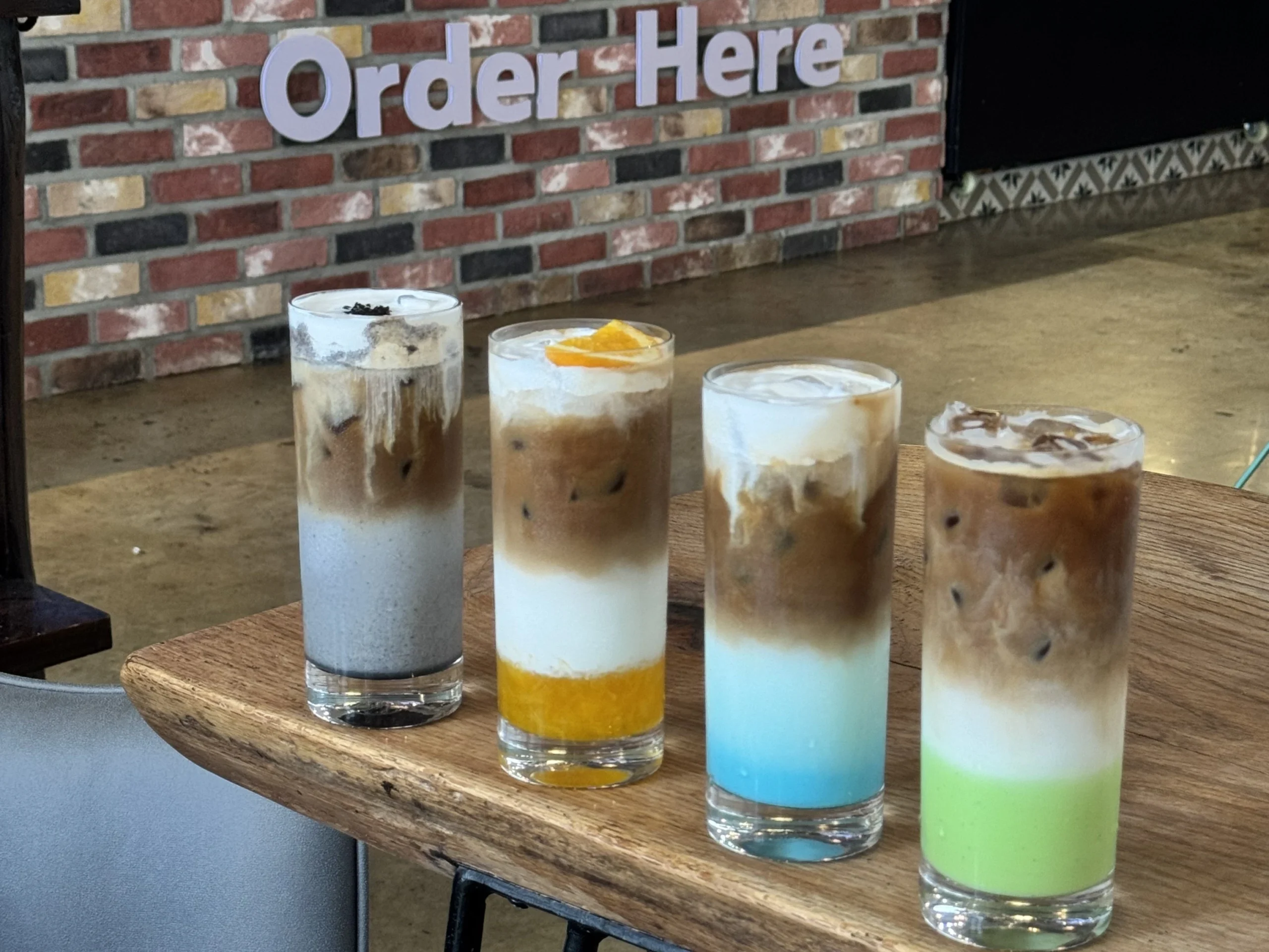 Colorful iced coffee drinks served at an outdoor cafe in Cavite
